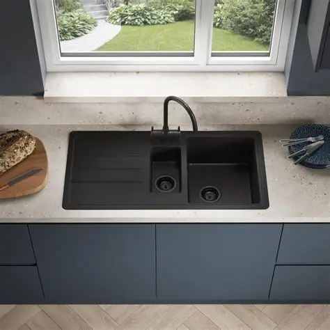 Inset kitchen sink dropped into a laminate worktop cutout, showing the visible rim resting on the worktop surface
