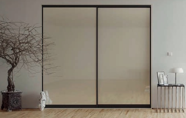 Glide sliding door system showing the patented aluminium frame profile and soft-close running mechanism